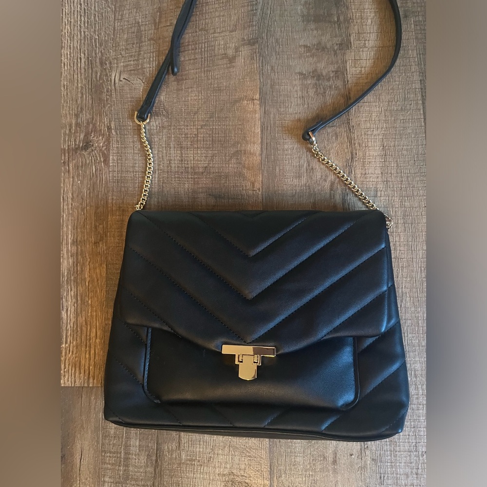 A New Day Black Quilted Shoulder Bag with zipper closure. New without tags.